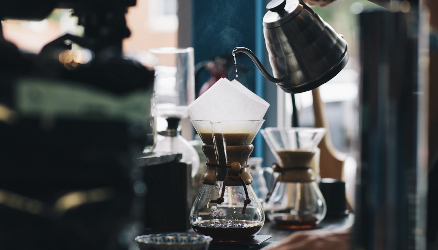 Chemex brewers and paper filters lined up at the pour-over station