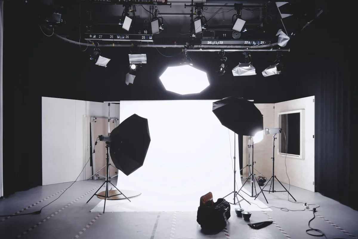 The studio floor with softboxes and lighting stands set up