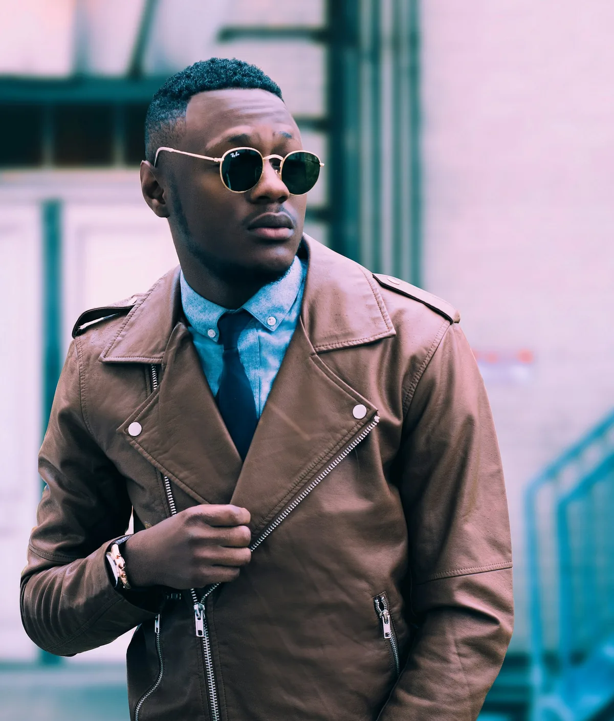 Street-style portrait of a man in a leather jacket