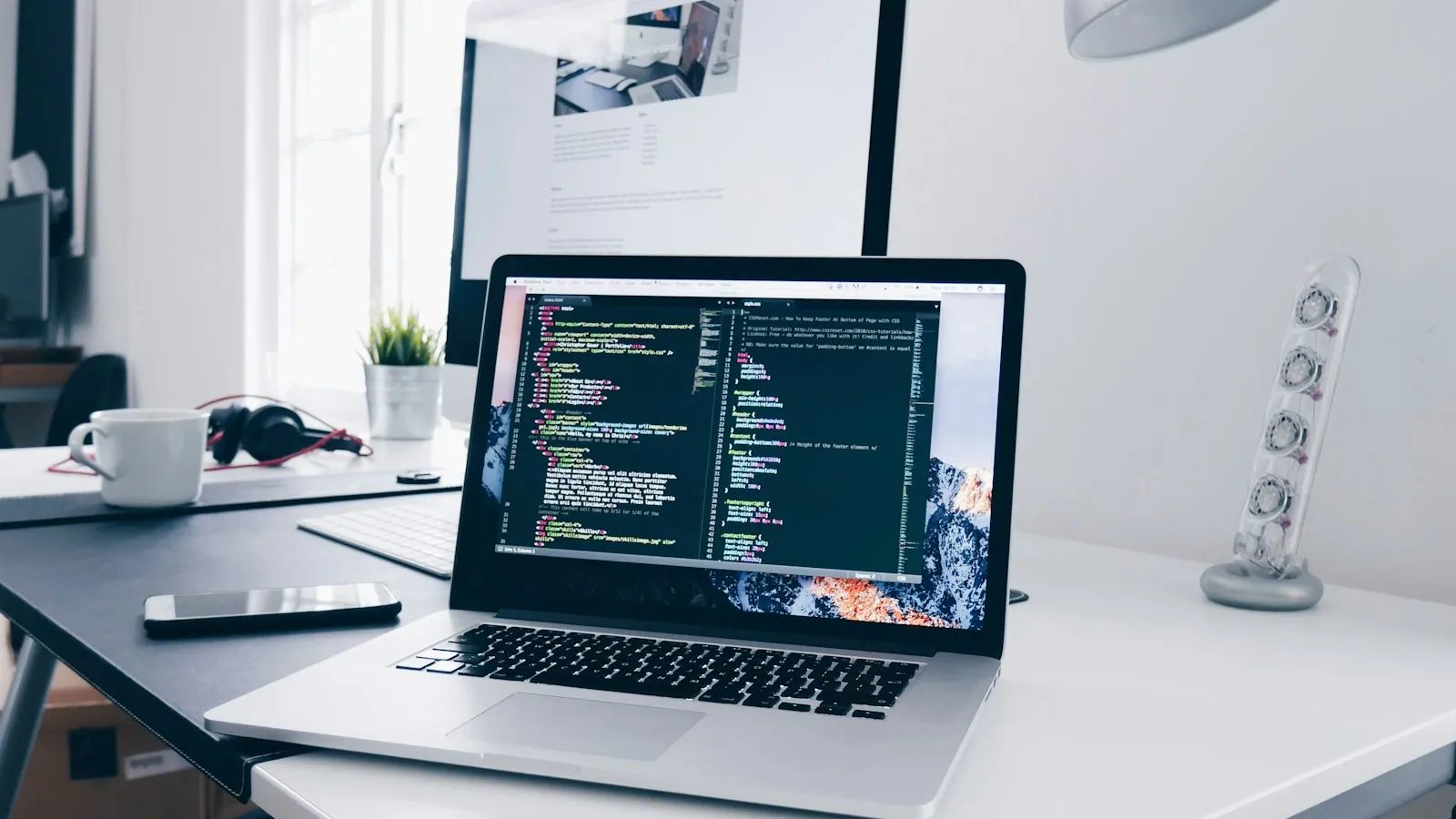 Developer workstation with application code on screen
