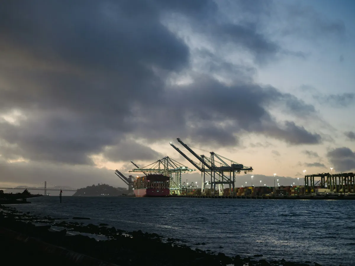 Gantry cranes working containers at a seaport on a SwiftRoute international lane
