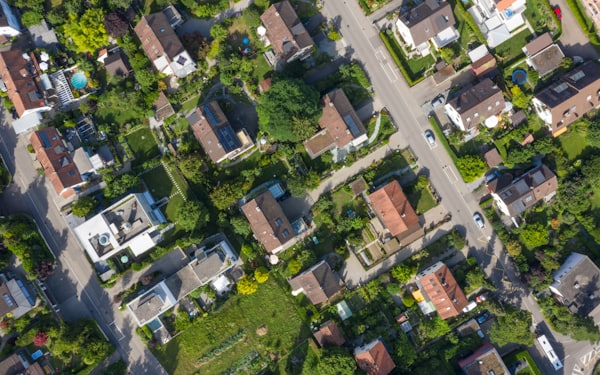An aerial view of surveyed housing lots divided by new roads