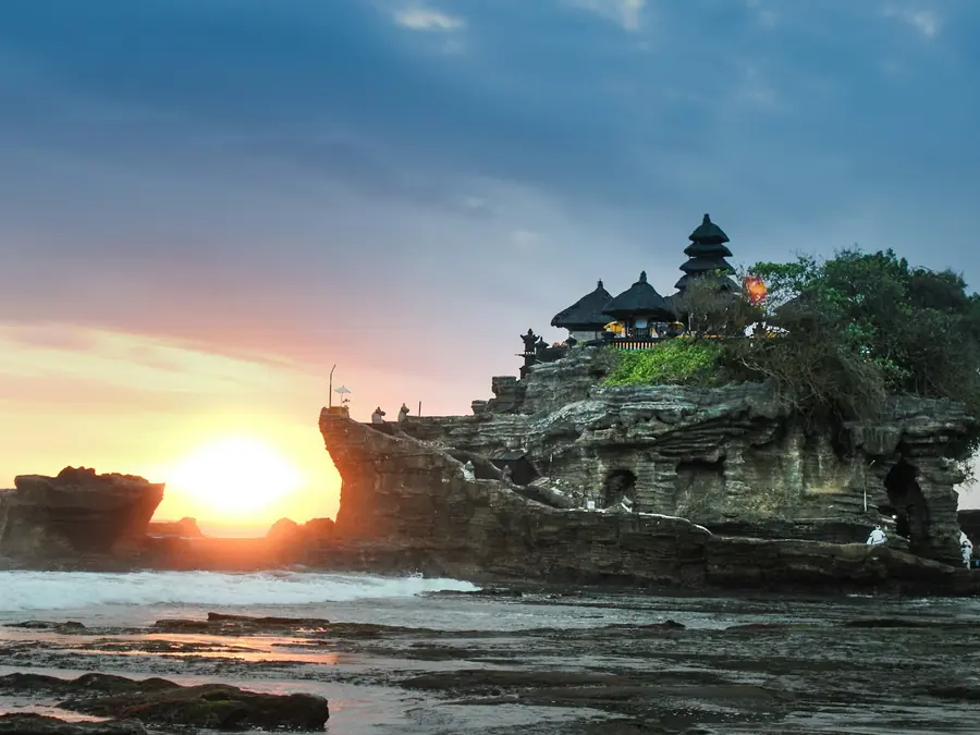 Tanah Lot sea temple in Bali silhouetted at sunset