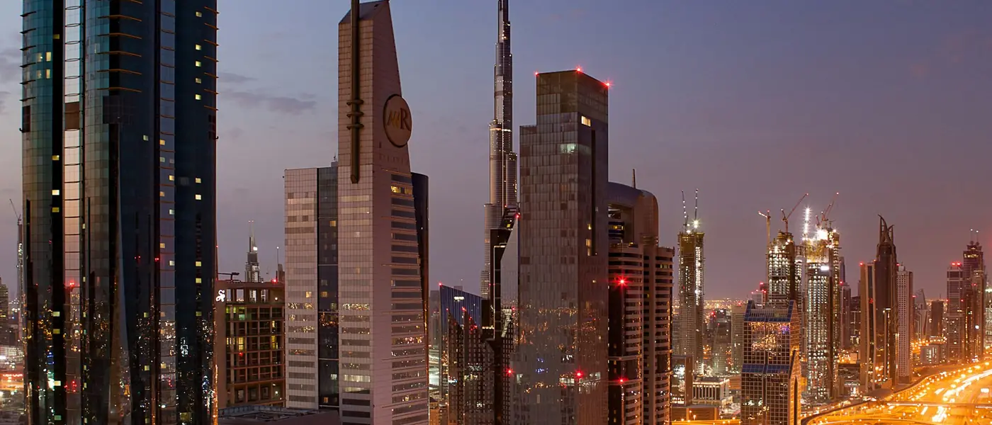 Sheikh Zayed Road skyscrapers lit at night in Dubai