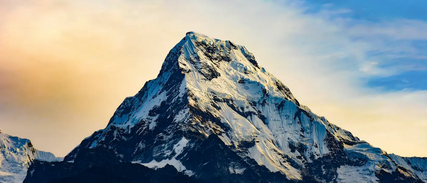 Snow-covered Himalayan peak under a clear sky in Kashmir