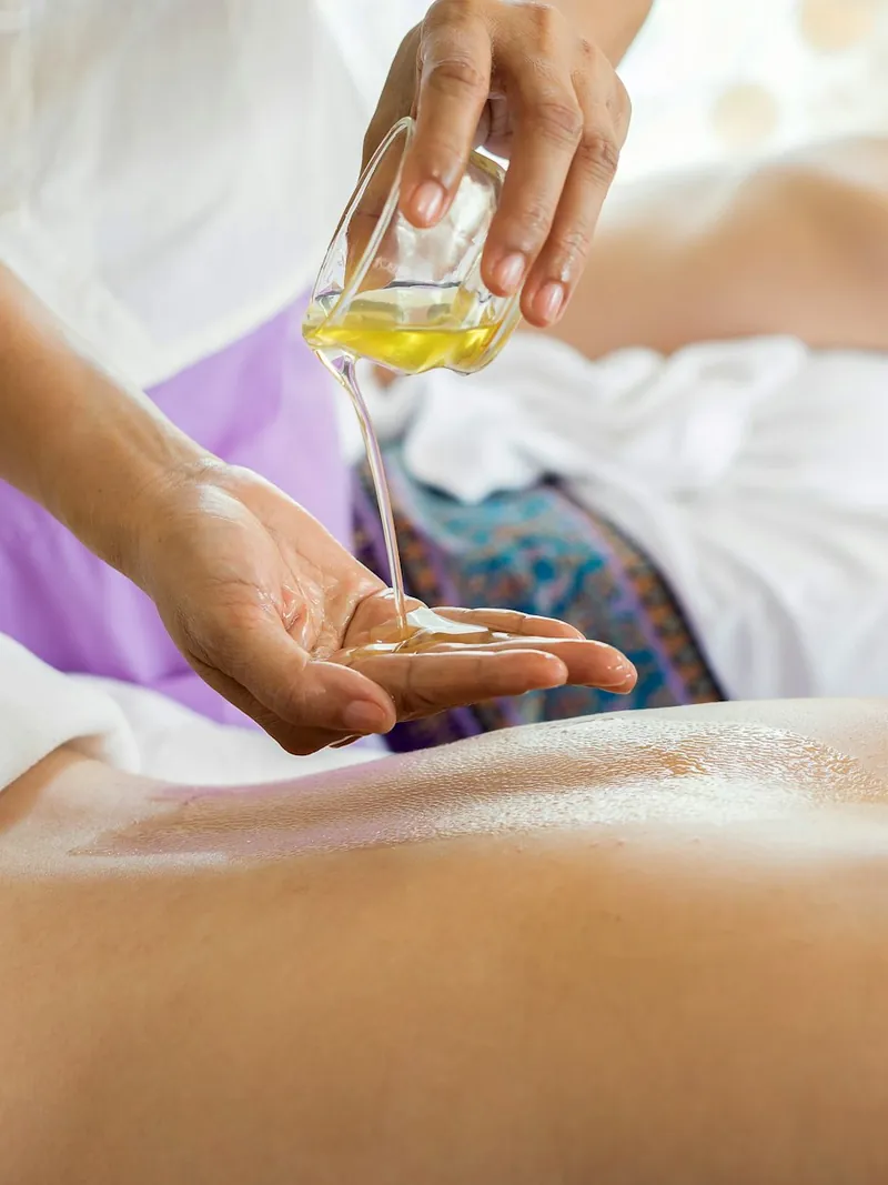 Guest receiving a relaxing oil massage at a spa