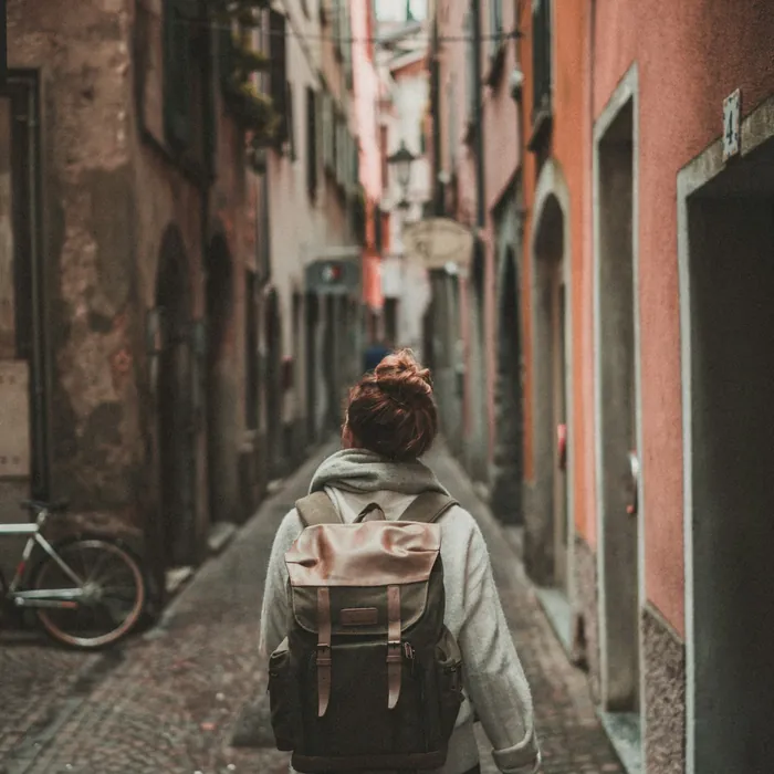 Traveller walking through a narrow European street