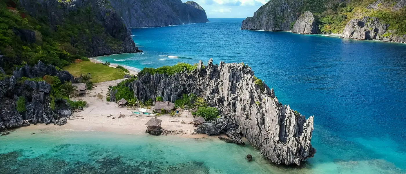 Limestone islands scattered across a clear tropical sea