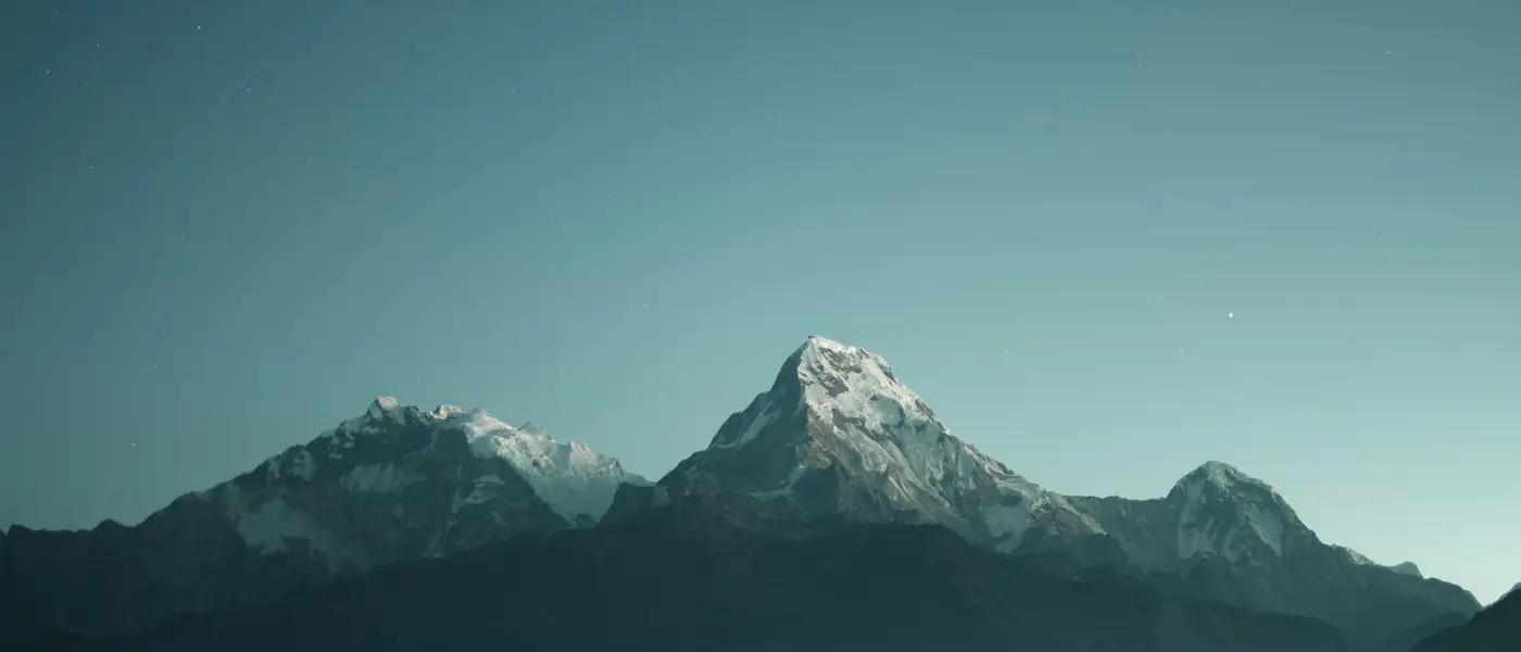 Layered blue mountain ridges fading into mist