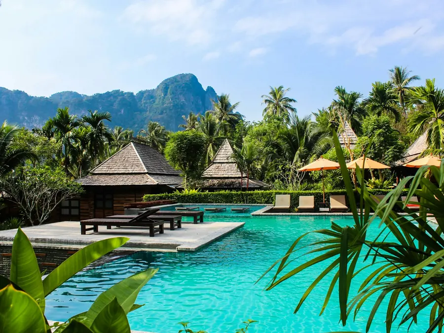 Tropical resort pool framed by palms in Bali