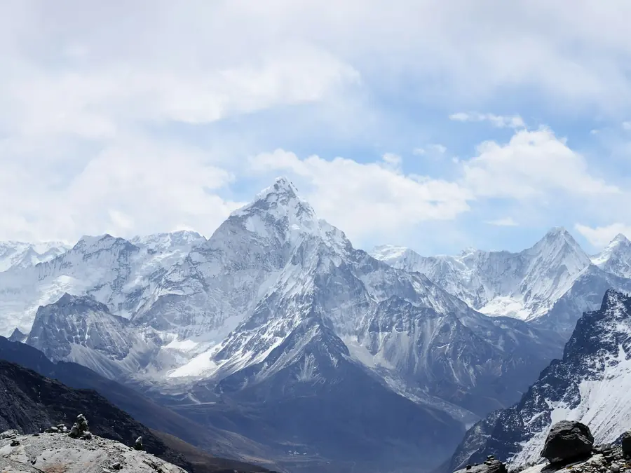Snow-covered peaks under clear skies in Kashmir